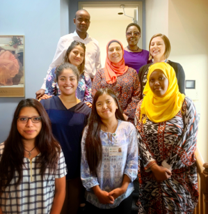 The doulas took a break from training with (rear row, from left) Kheir Mugwaneza, Senior Project Manager for Allegheny Health Network’s training program; WHAMglobal Global Health Associate Hanifa Nakiryowa; and Project Coordinator Katie Hyre.